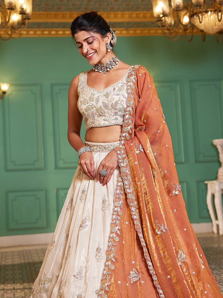 Off White Rust Viscose Lehenga Choli With Motifs & Rich Embroidery