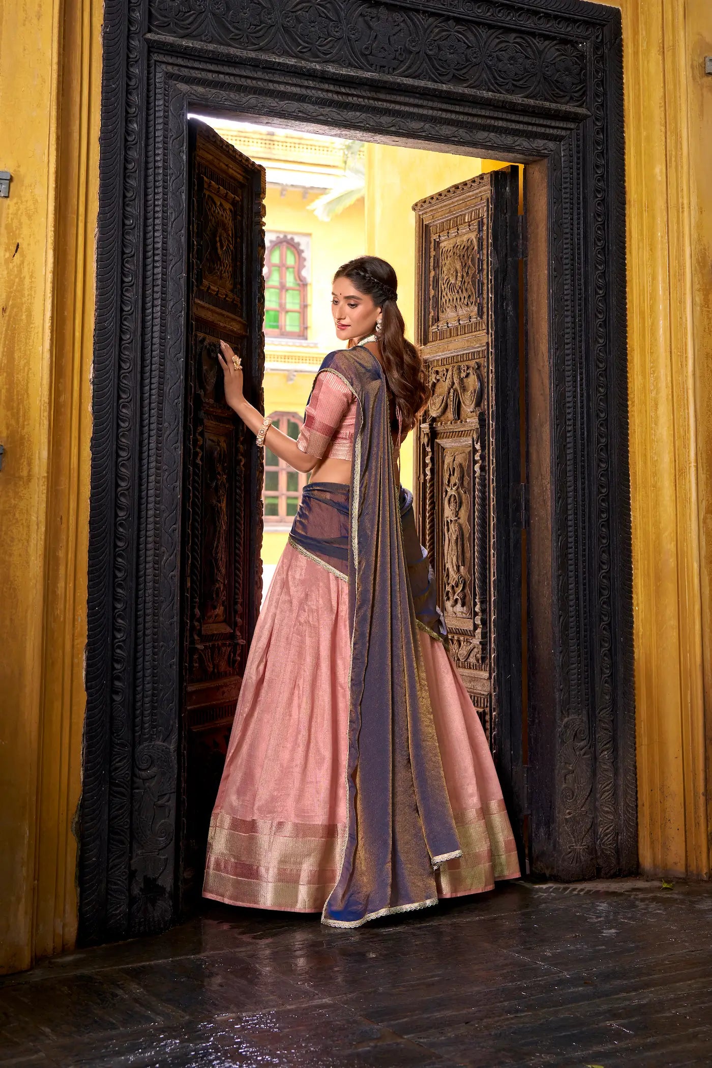Back view of light pink dhupian silk zari weaving lehenga choli full look