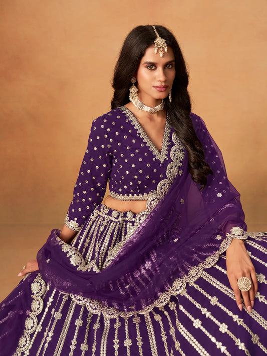 Close-up of purple art silk lehenga choli showing paper mirror and embroidery blouse detailing