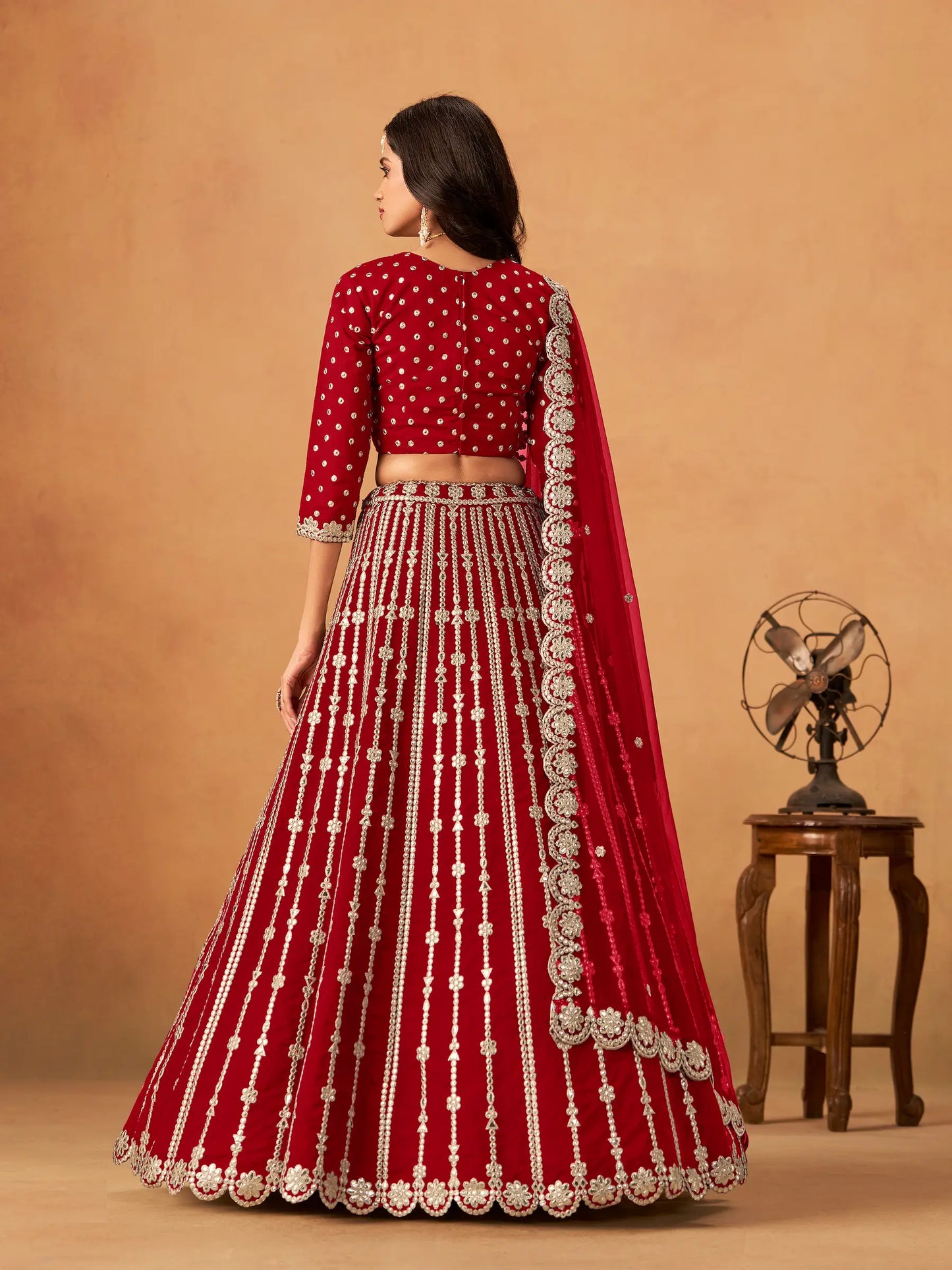 Back view of red art silk paper mirror and embroidery lehenga choli full look