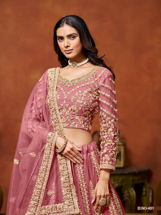 Half view of light pink net lehenga choli showing embroidered blouse detailing