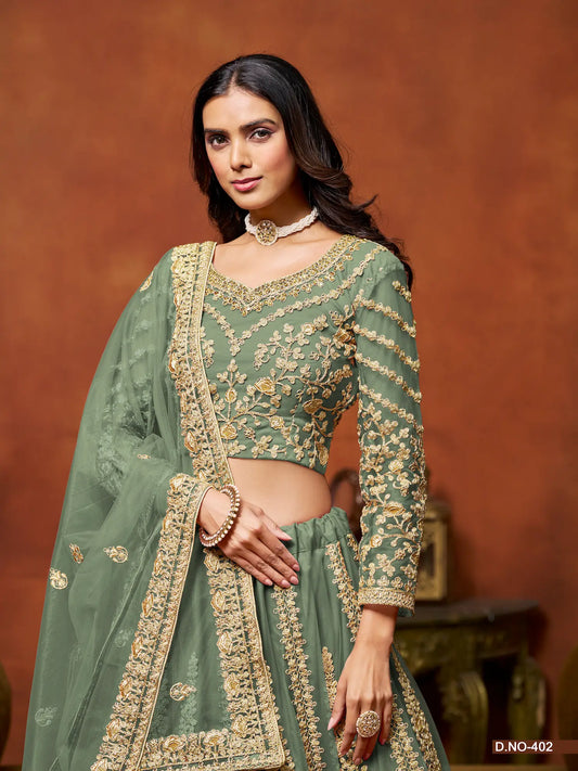 Pista green net lehenga choli showing embroidered blouse detailing
