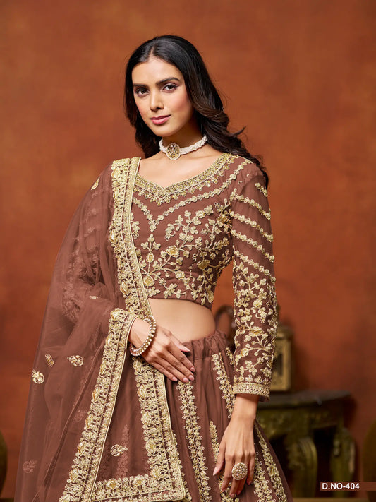 Half view of brown net lehenga choli showing embroidered blouse detailing