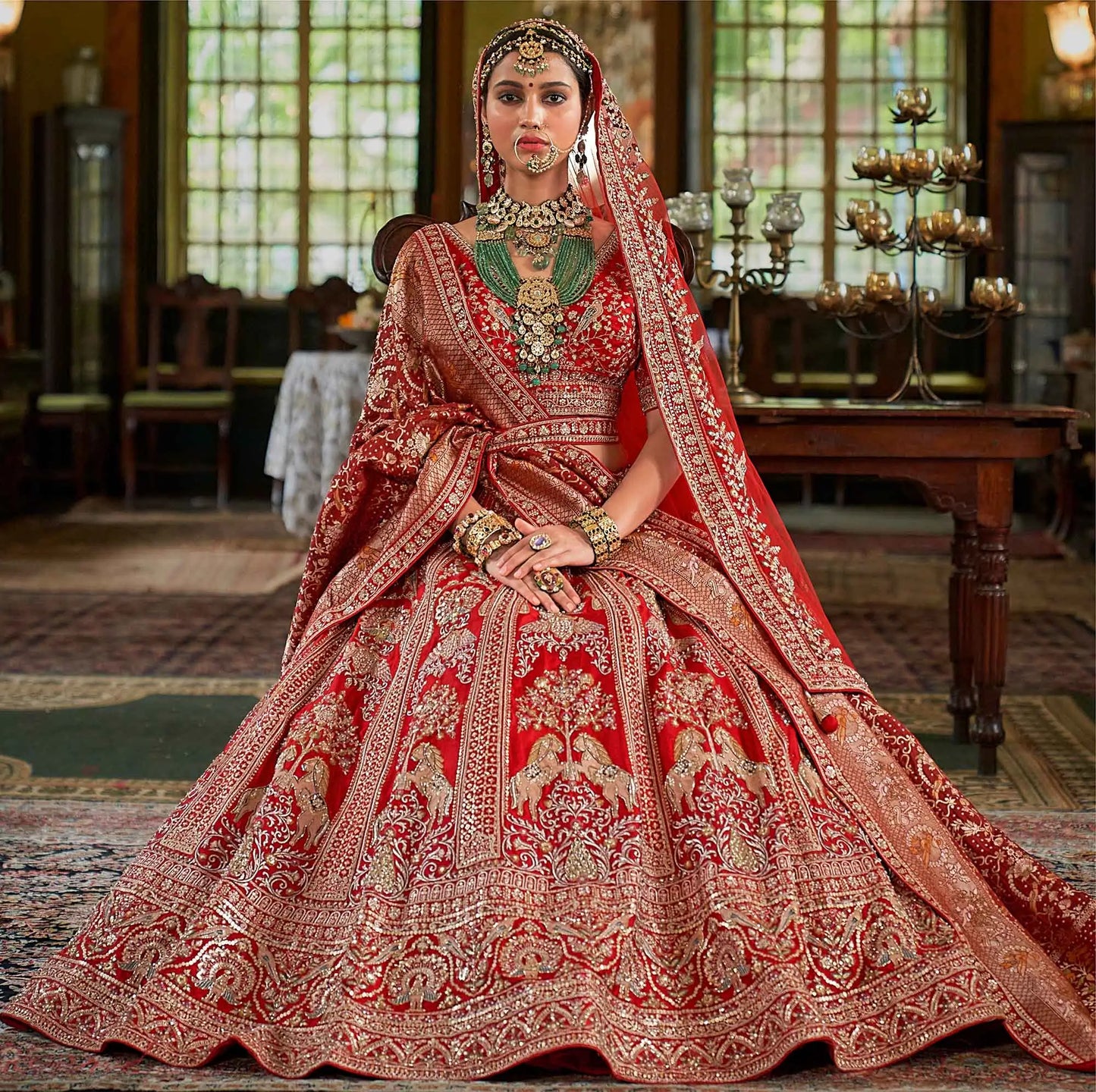 Red Bridal Lehenga Featuring Rich Embroidery & Pearl