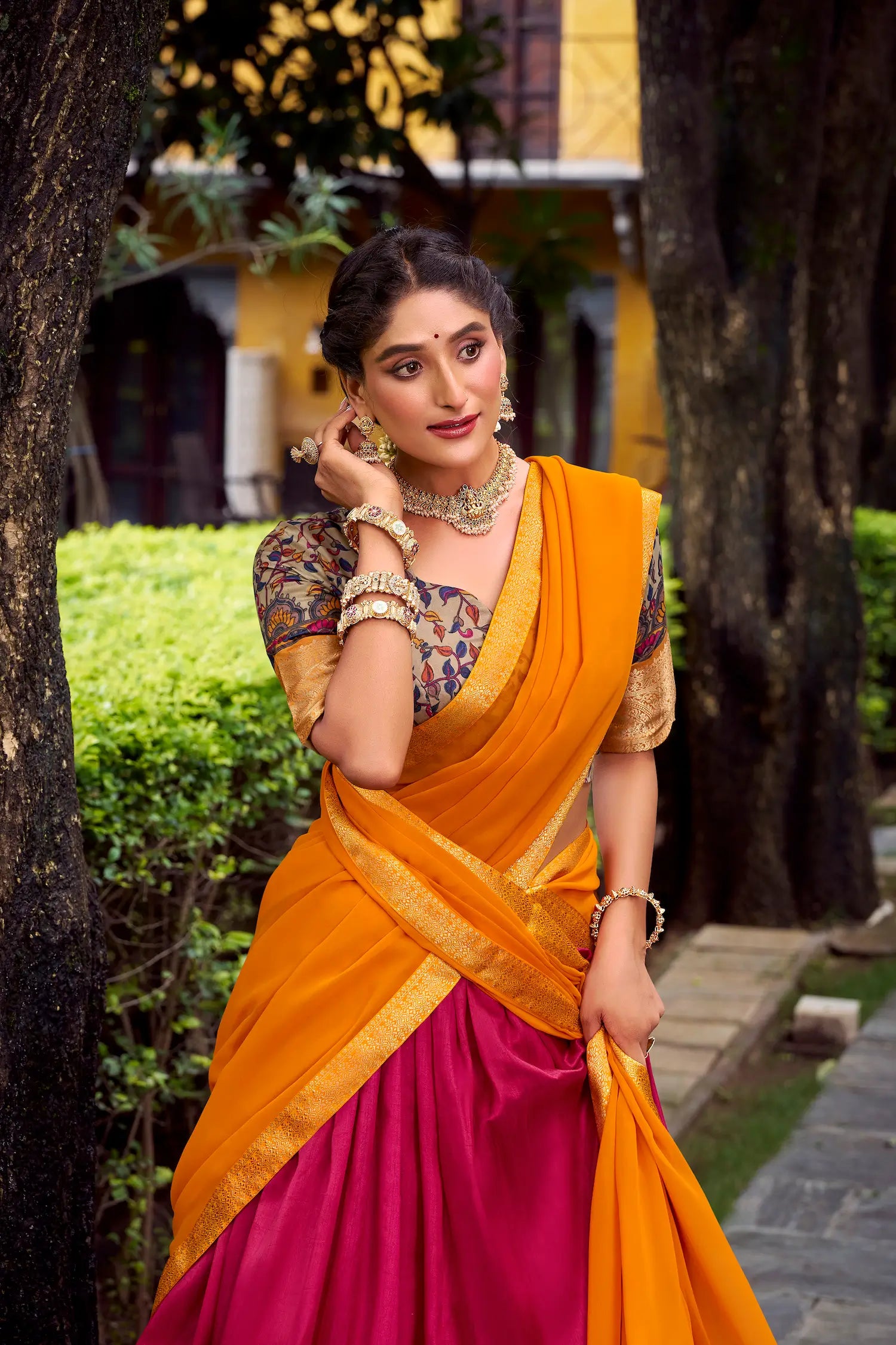 Close-up of hot pink printed silk lehenga choli showing zari weaving detailing
