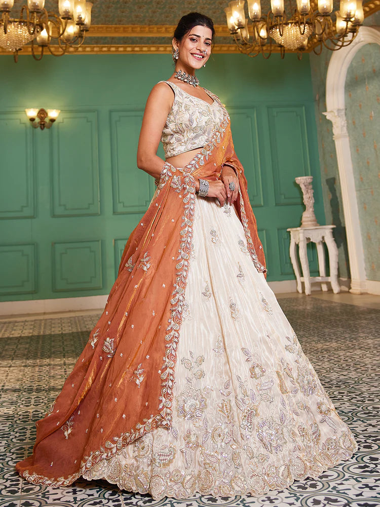 Off White Rust Viscose Lehenga Choli With Motifs & Rich Embroidery