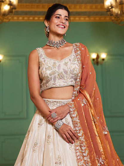Off White Rust Viscose Lehenga Choli With Motifs & Rich Embroidery
