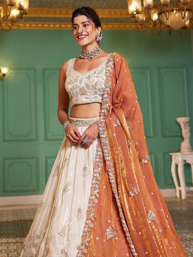 Off White Rust Viscose Lehenga Choli With Motifs & Rich Embroidery