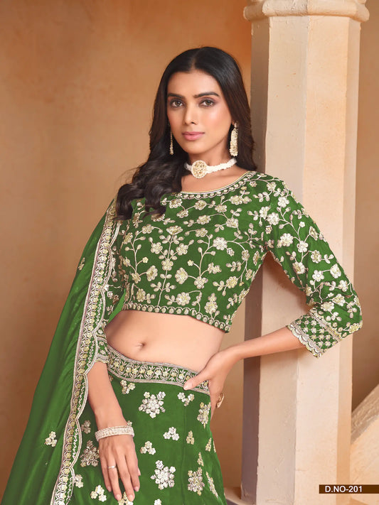 Half view of green organza lehenga choli showing embroidered blouse detailing