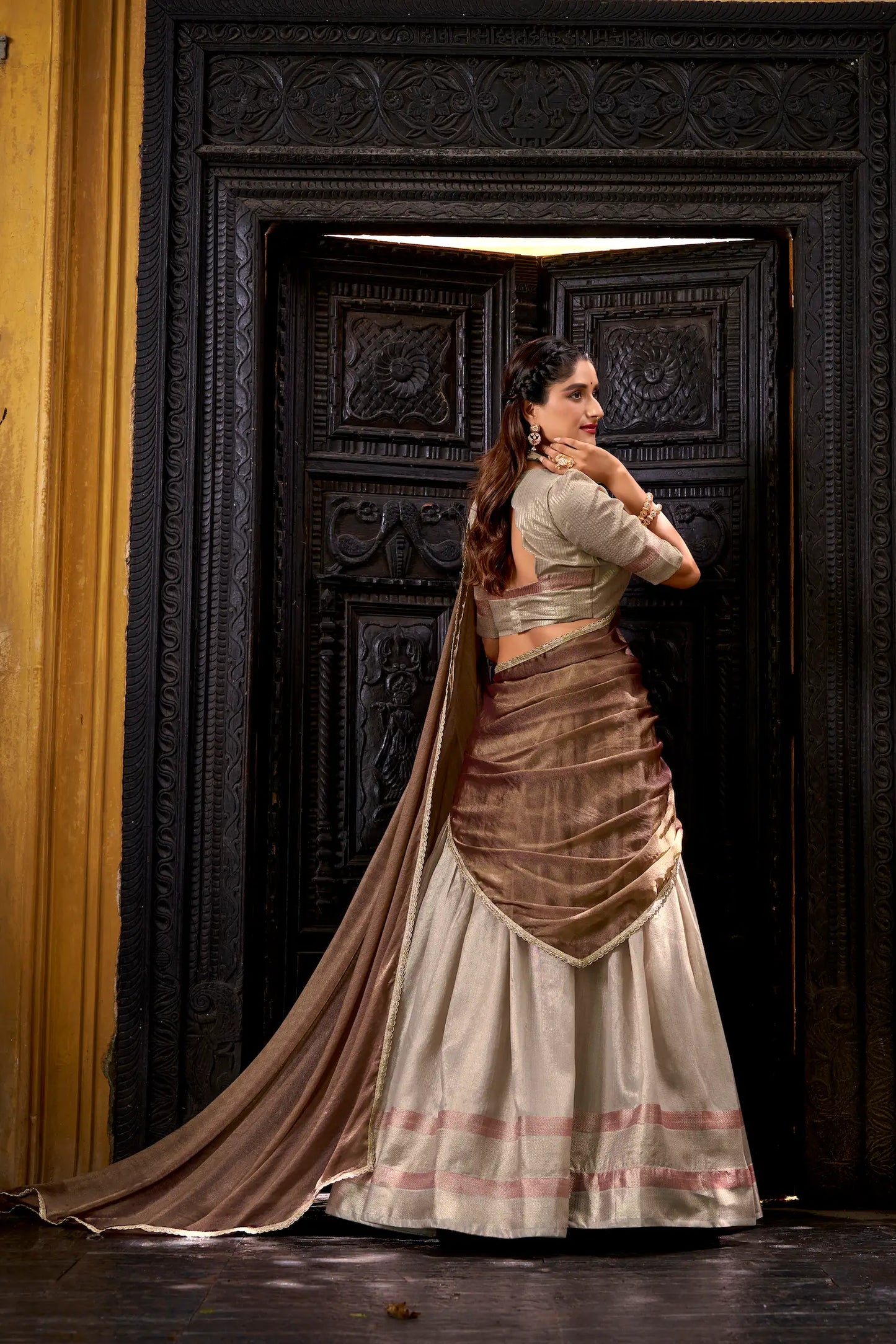 Back view of sand beige dhupian silk zari weaving lehenga choli full look