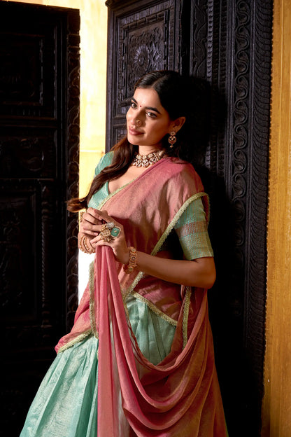 Half view of sea blue dhupian silk lehenga choli showing zari weaving work