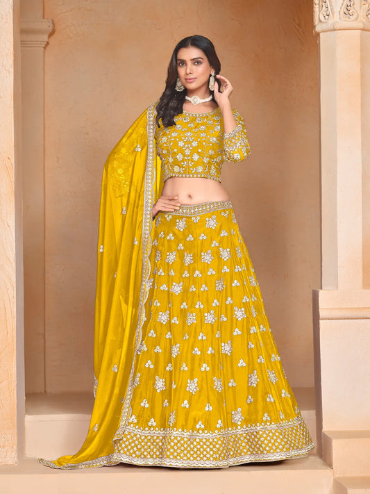 Yellow organza lehenga choli with thread and sequence embroidery work