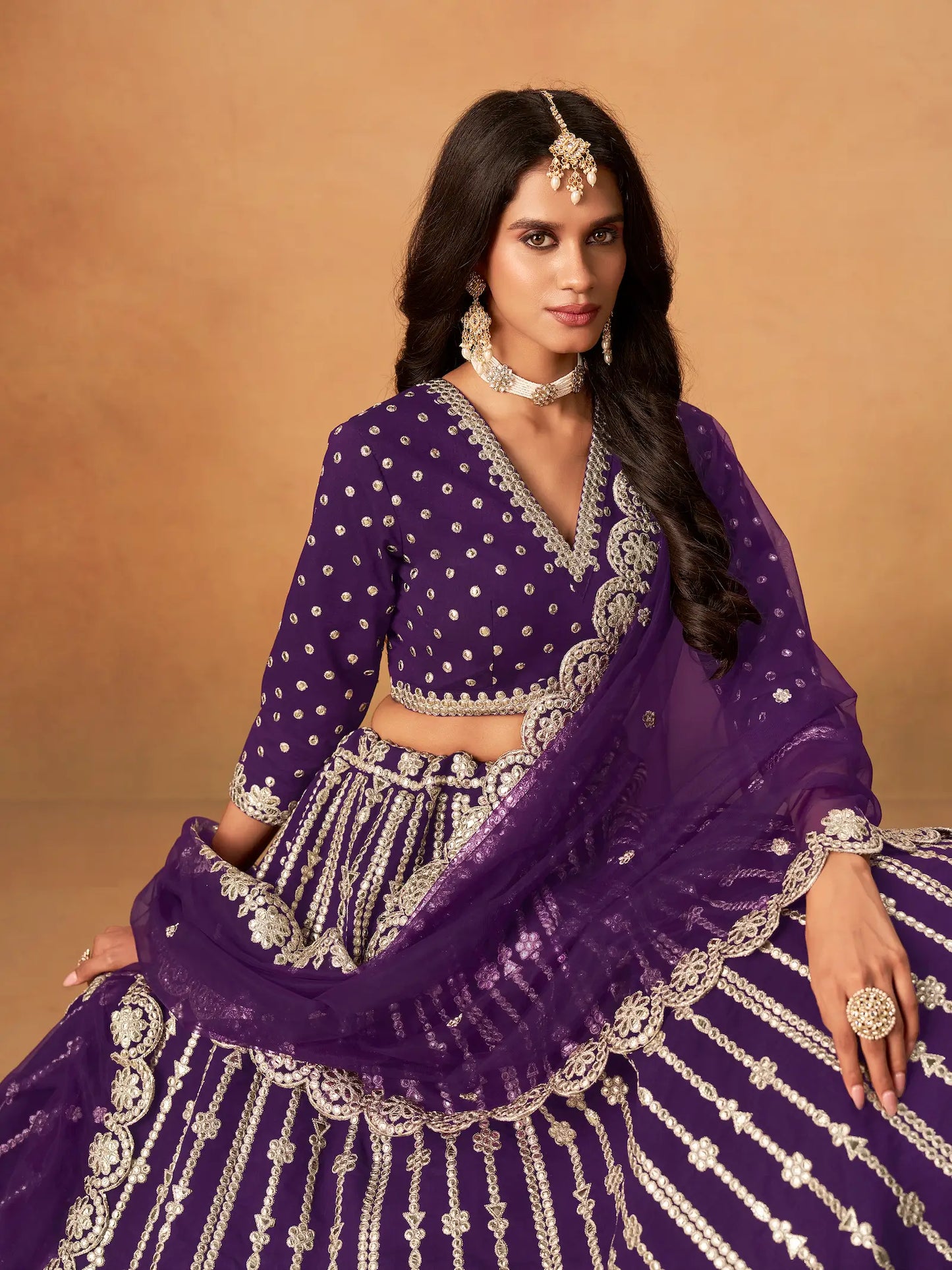 Close-up of purple art silk lehenga choli showing paper mirror and embroidery blouse detailing