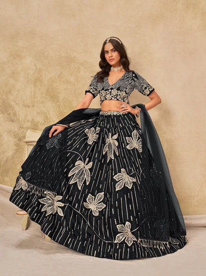 Model sitting wearing black art silk lehenga choli with sequins embroidery work