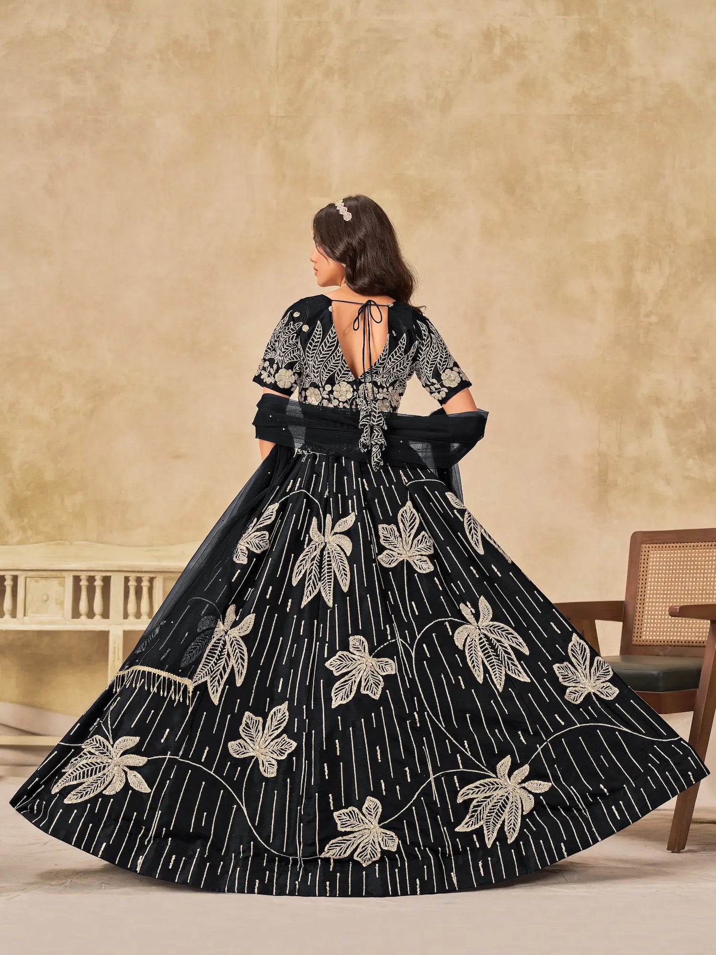 Back view of black art silk lehenga choli with dupatta and sequins embroidery detailing
