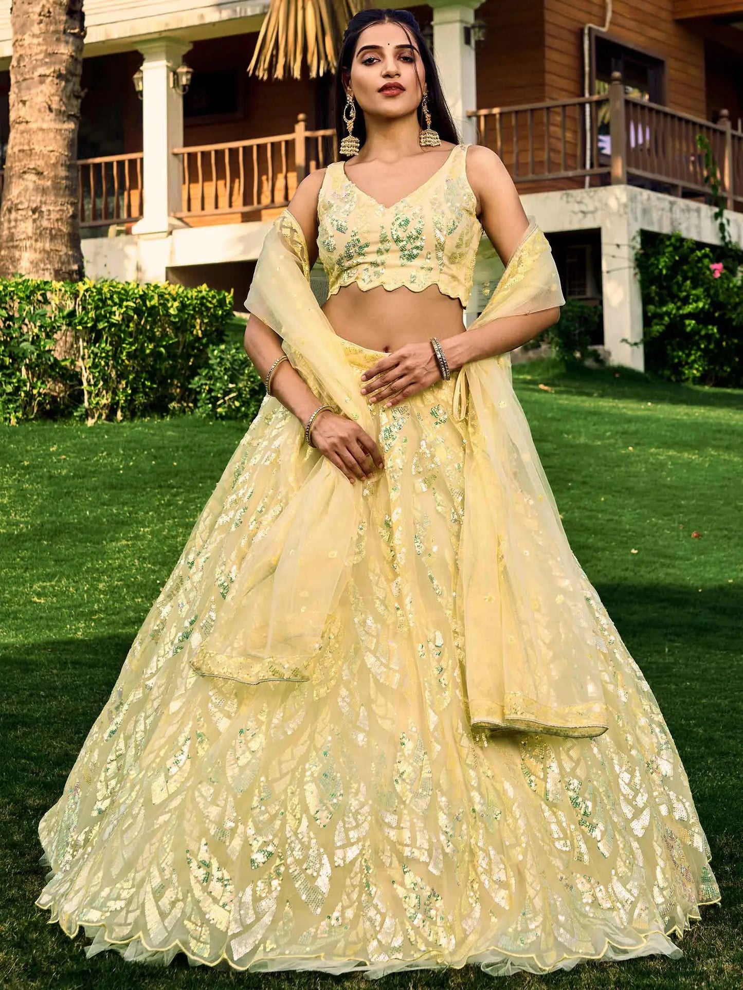 Yellow Soft Net Lehenga With Multiple Sequins And Thread Embroidery Work