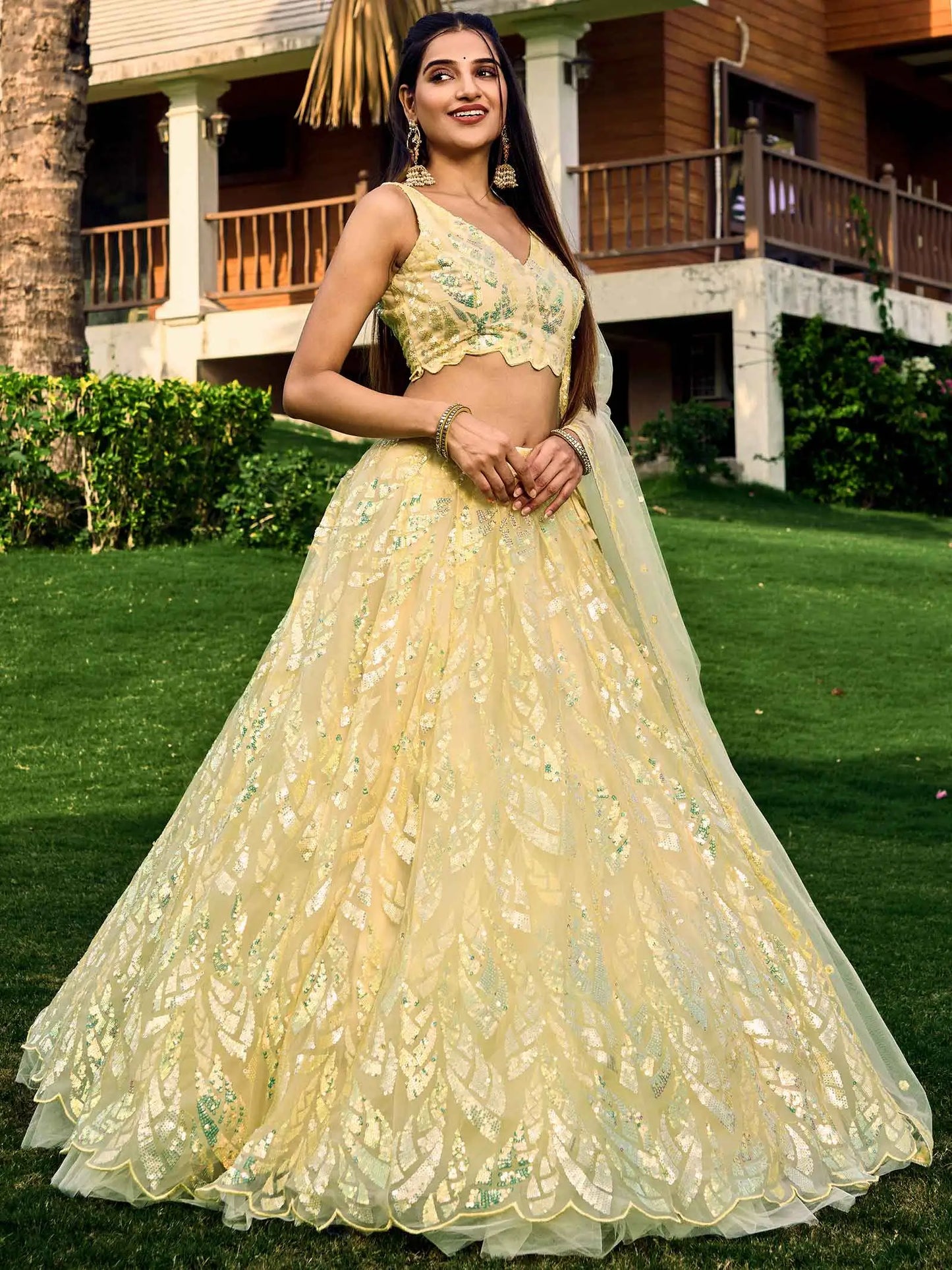 Yellow Soft Net Lehenga With Multiple Sequins And Thread Embroidery Work