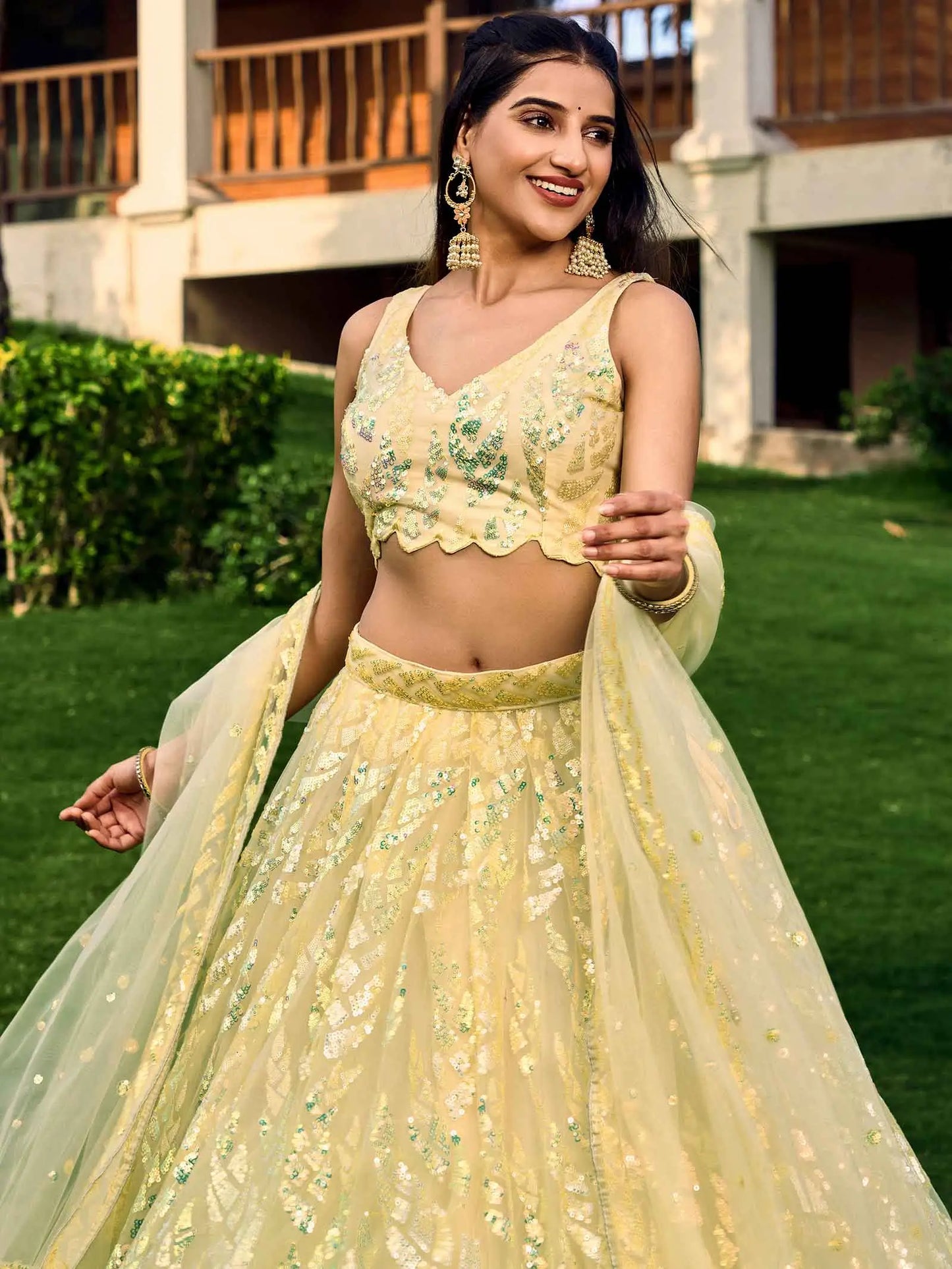 Yellow Soft Net Lehenga With Multiple Sequins And Thread Embroidery Work