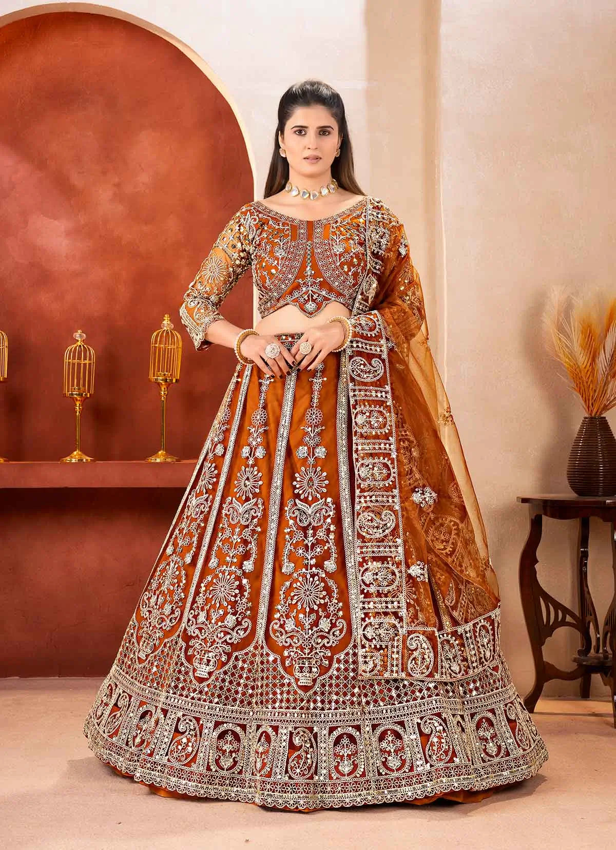 Rust Embroidered Codding Net Lehenga Choli