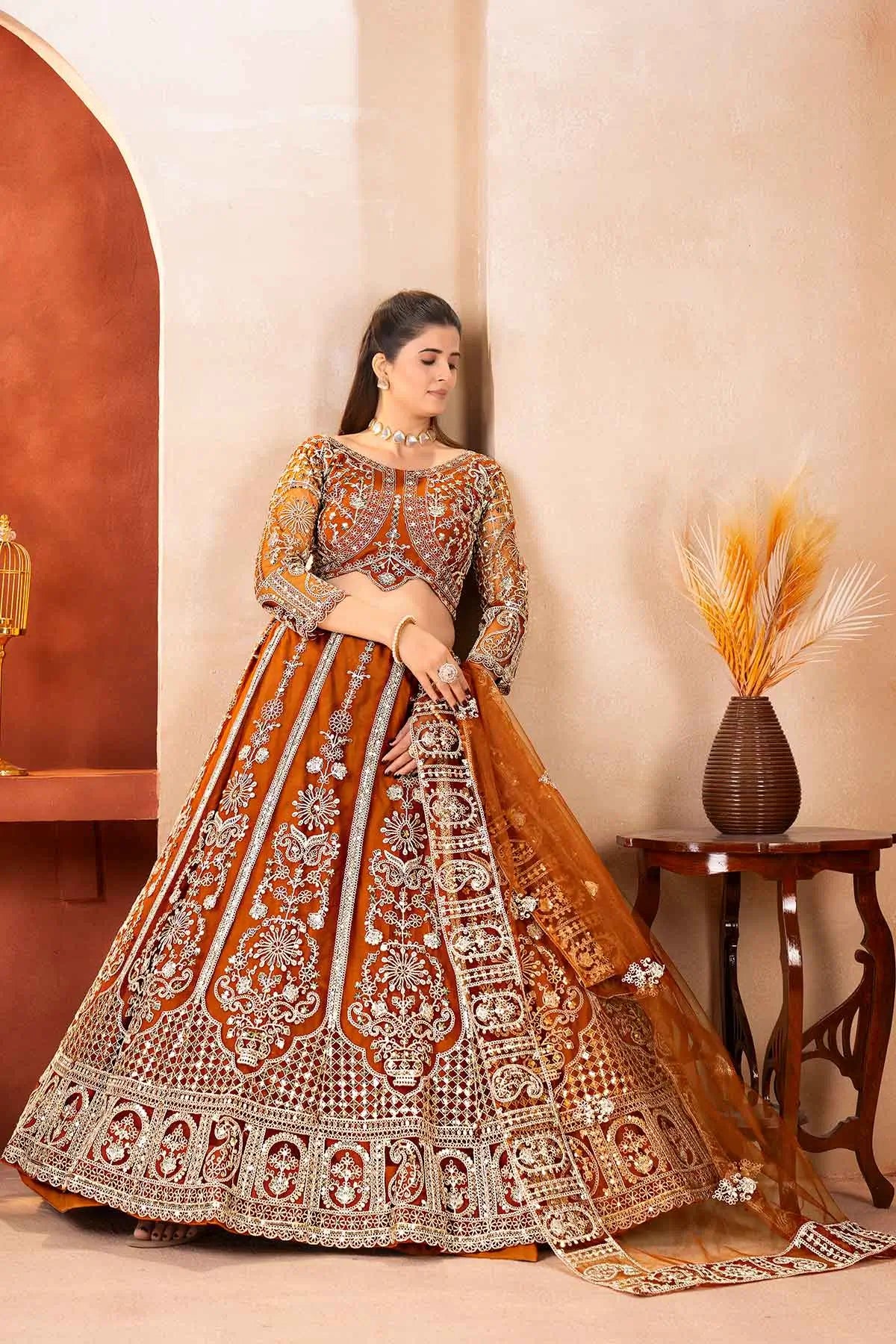Rust Embroidered Codding Net Lehenga Choli
