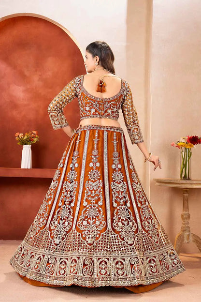 Rust Embroidered Codding Net Lehenga Choli