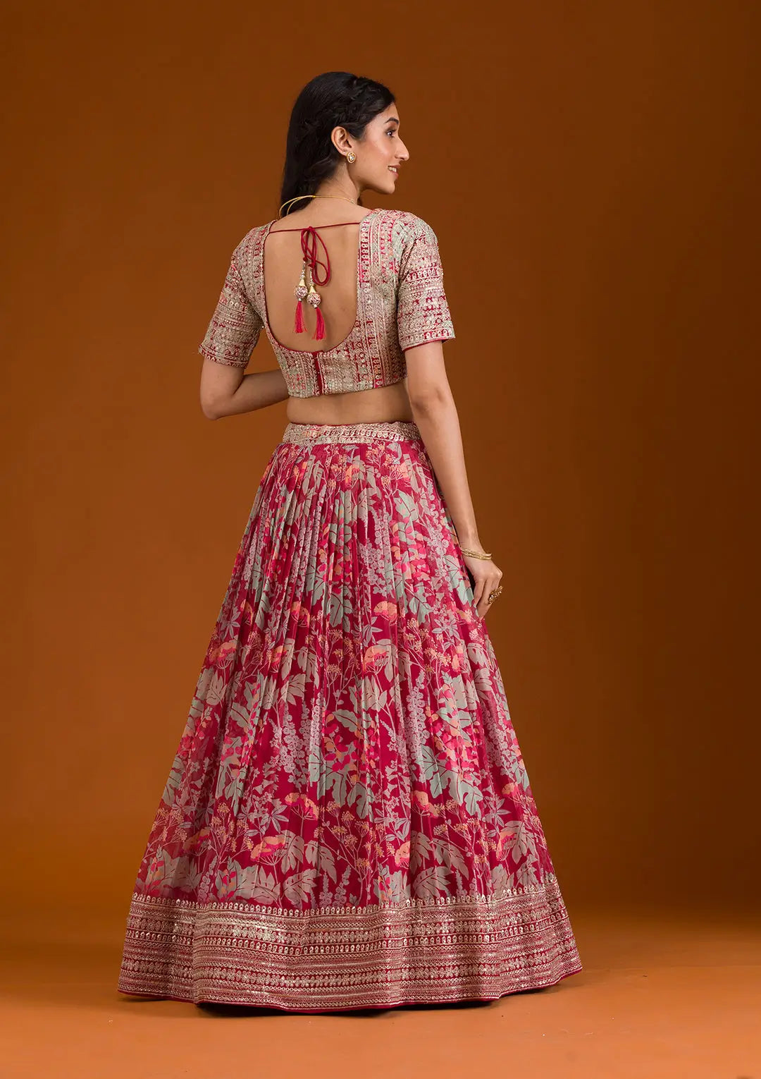 Back view of peach organza lehenga with dupatta