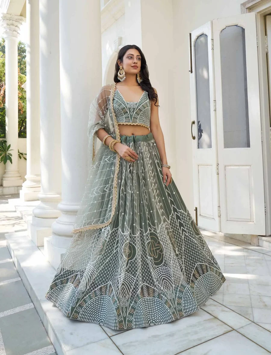 Traditionally Styled Dusty Green Net Sequence Lehenga Choli