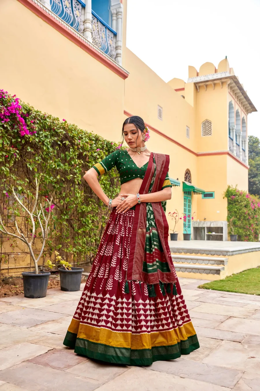 Fabulous blend of Wine Red and Lunar Green silk Patola lehenga choli