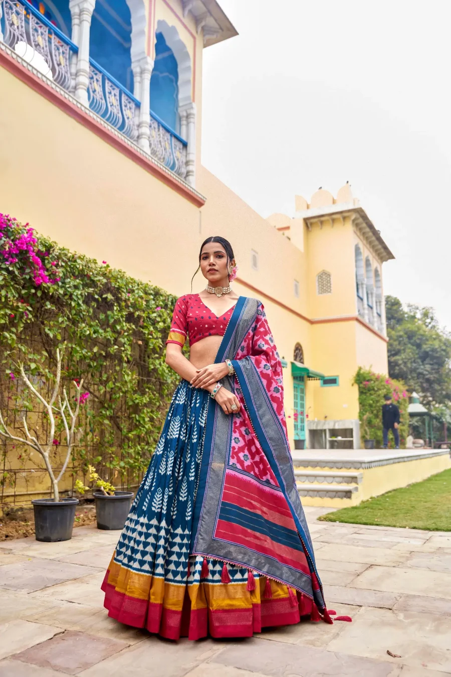 Fabulous blend of Regal Blue and Hot Pink silk Patola lehenga choli