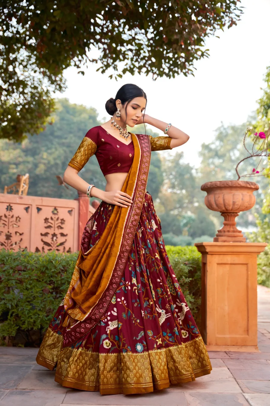 wine red silk patola Lehenga choli with foil print and Meenakari work