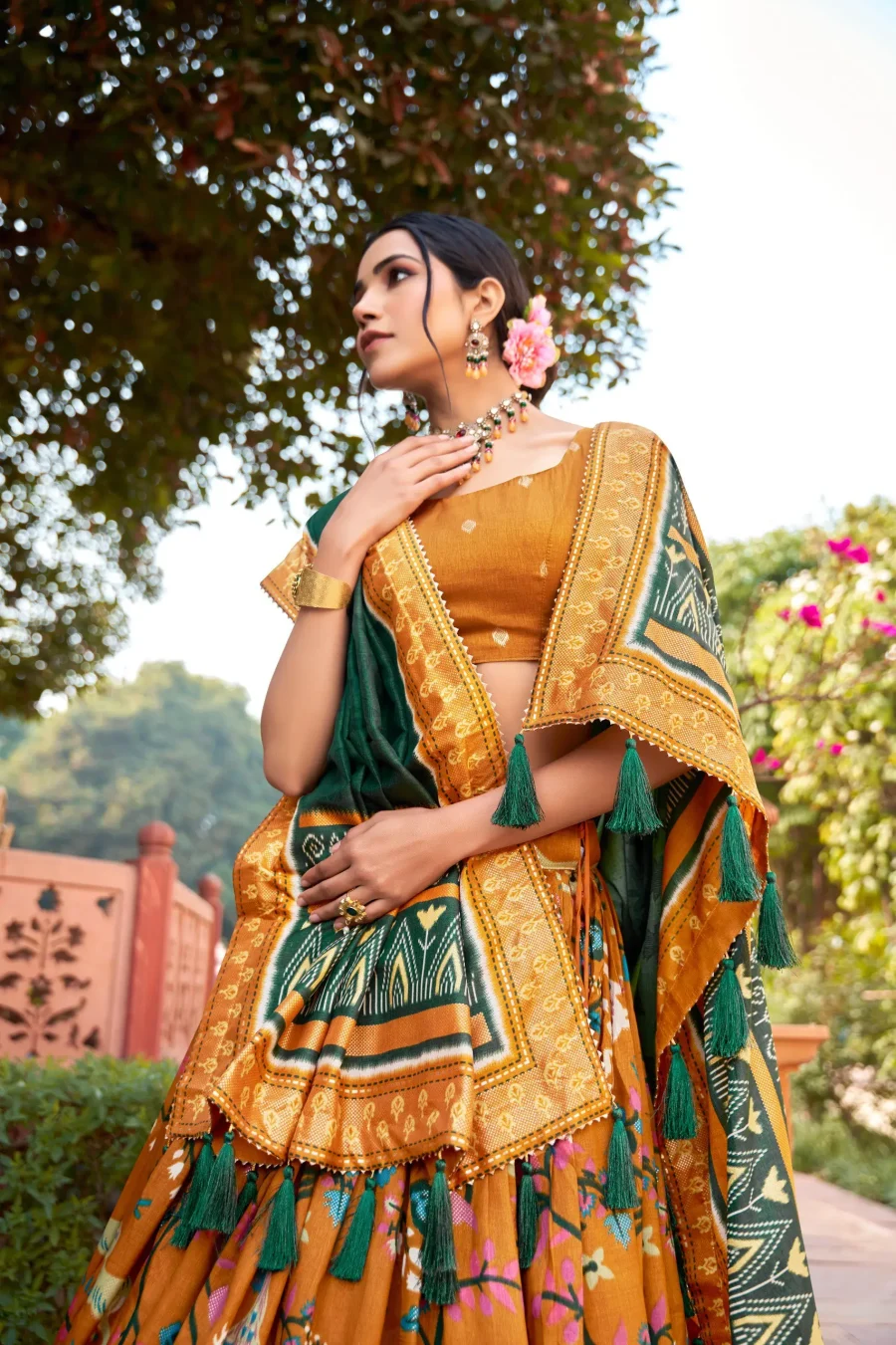 Cadmium Orange silk patola Lehenga choli with foil print and meenakari work