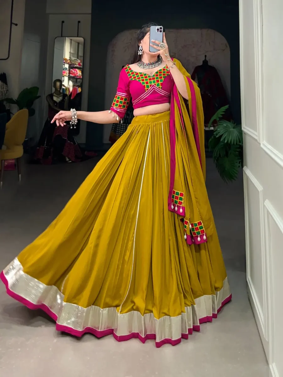 love Of Dark goldenrods Lehenga choli with Gamthi Work & Cowrie (Kodi) Lace Border