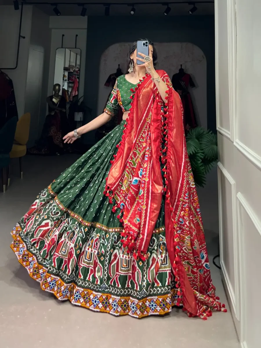 Tealish Green Silk Lehenga choli with Patola Printed Gamthi & Mirror Lace work